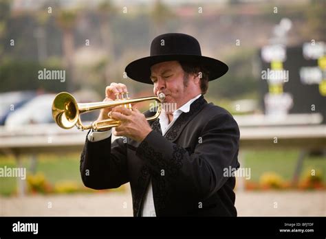 A Man Plays The Call To Post On His Bugle At A Horse Track At The Del A Man Plays The Call To Post On His Bugle At A Horse Track At The Del
