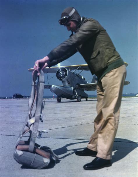 A Us Coast Guard Pilot Dons A Parachute In Front Of A Grumman Jf 2 Duck A Us Coast Guard Pilot Dons A Parachute In Front Of A Grumman Jf 2 Duck