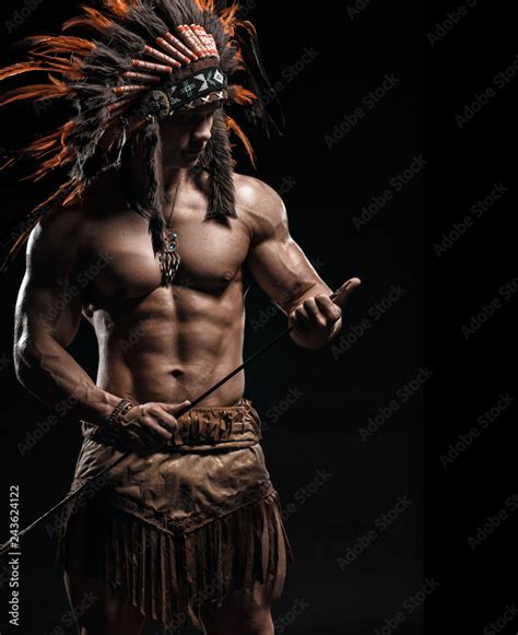 American Indian Apache Warrior Chief In Traditional Clothing And American Indian Apache Warrior Chief In Traditional Clothing And