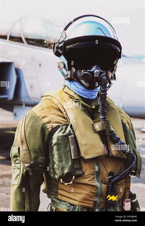Fighter Pilot Helmet And Suit In Front Of Fighter Jet Premium Photo Fighter Pilot Helmet And Suit In Front Of Fighter Jet Premium Photo