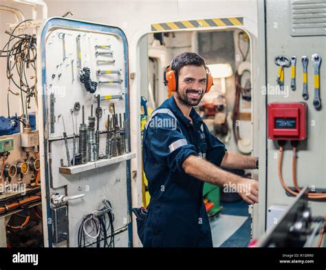 Marine Engineer Officer Working In Engine Room Stock Photo Alamy Marine Engineer Officer Working In Engine Room Stock Photo Alamy