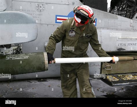 Marines From Marine Air Control Squadron Macs 2 Load Ordnance On A Marines From Marine Air Control Squadron Macs 2 Load Ordnance On A