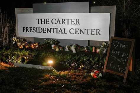 Mourners Place Peanuts Peaches Outside Of Carter Center Following Mourners Place Peanuts Peaches Outside Of Carter Center Following
