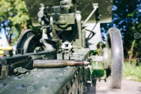 Shell Missile Is Lying On Old Metal Green Cannon From The Time Of Shell Missile Is Lying On Old Metal Green Cannon From The Time Of