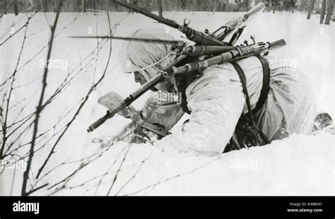 Soviet Russian World War 2 Medic Collects Rifles From As He Treats
