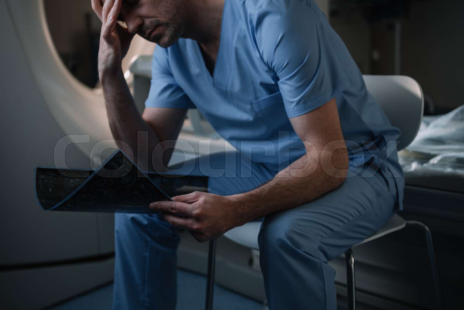 Tired Radiologist With X Ray Image In Hospital Stock Photo Alamy Tired Radiologist With X Ray Image In Hospital Stock Photo Alamy