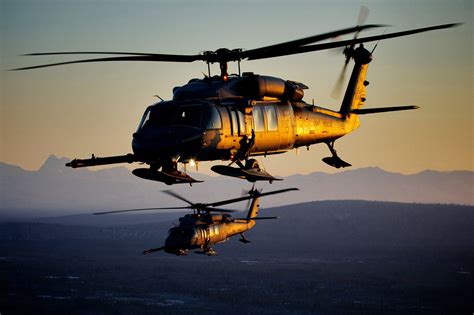 Two U S Air Force Hh 60 Pave Hawk Recovery Helicopters Fly Over Alaska Two U S Air Force Hh 60 Pave Hawk Recovery Helicopters Fly Over Alaska