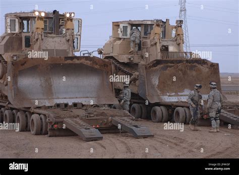 U S Army Soldiers Prepare To Unload Two Armored Caterpillar D9 Bulldozers U S Army Soldiers Prepare To Unload Two Armored Caterpillar D9 Bulldozers